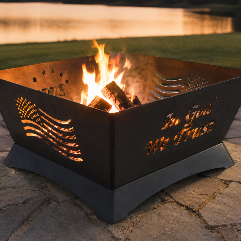 24 inch patriotic steel fire pit with American flag and In God We Trust cutout design, glowing from an internal fire